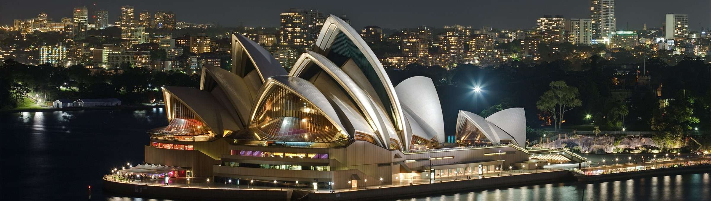 The Sydney Opera House lit at night on the harbour
